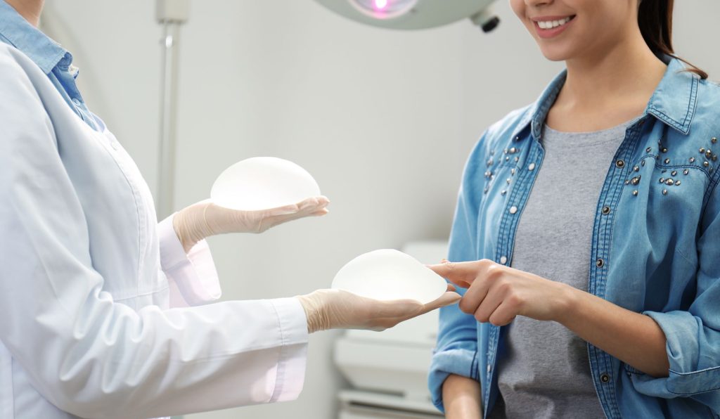 woman choosing implant for breast augmentation in richmond va